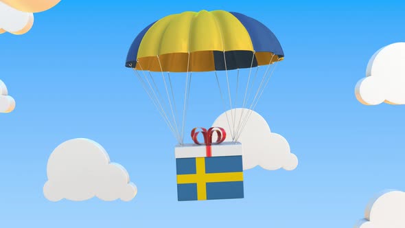 Carton with Flag of Sweden Falls with a Parachute