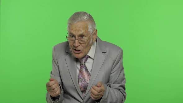 Elderly Businessman in Suit Something Emotionally Tells. Chroma Key Background