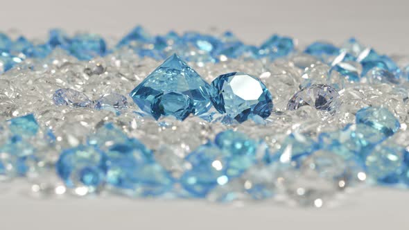 A Pile Of Blue Diamonds Placed In The Center Of A White Diamond.