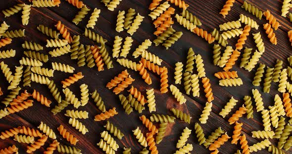 Messy Arrangement of Pasta on Wood