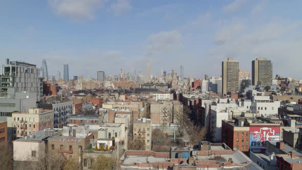 Rising Aerial View of SoHo Manhattan and NYC Skyscrapers from a Distance