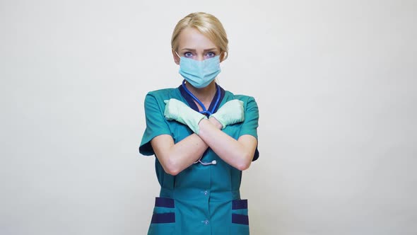 Medical Doctor Nurse Woman Wearing Protective Mask and Rubber or Latex Gloves - Stop Sign Gesture