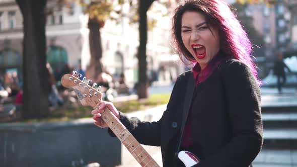 Asian Girl Like Rock Star Performing Show at the Street