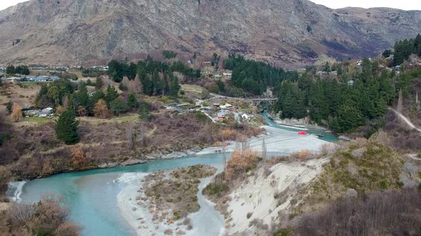 Aerial wide shot of Skippers canyon and Shotover River with view of Edith Cavell Bridge in Queenstow