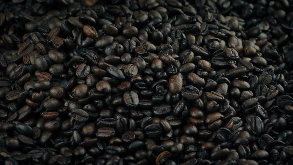 Roasted Coffee Beans Pouring Into Pile