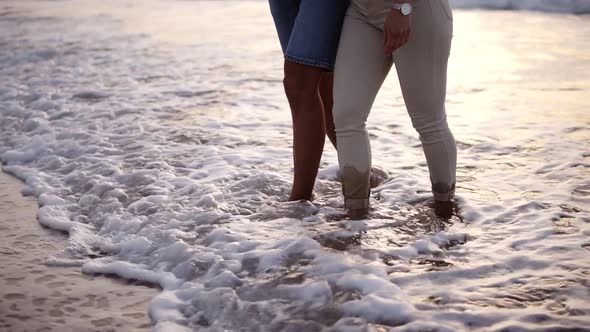 Close Up View Video of Man and Woman Walking Barefeet at Sandy Beach By Ocean