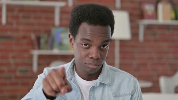 African Male Pointing Finger at Camera