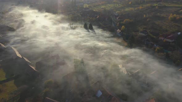 High Angle View of Early Morning Haze Over a Village