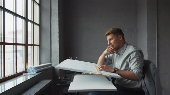 Thinking young businessman in the office