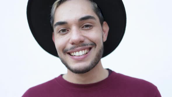 Authentic Shot of Young Hipster Man Smiling on Camera Outdoor