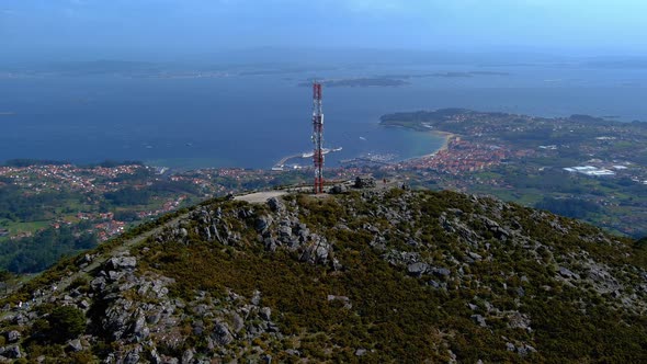 Aerial View Of Telecommunications Mast On Rocky Hillside In Miradoiro da Curota With Ria de Arousa I