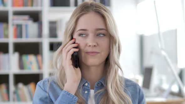 Young Woman Talking on Phone