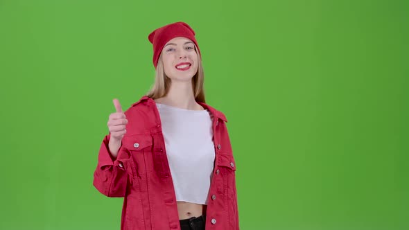 Teenager Advertises a Product and Shows a Thumbs Up. Green Screen