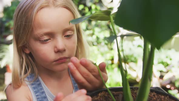 Little girl gardening in nature
