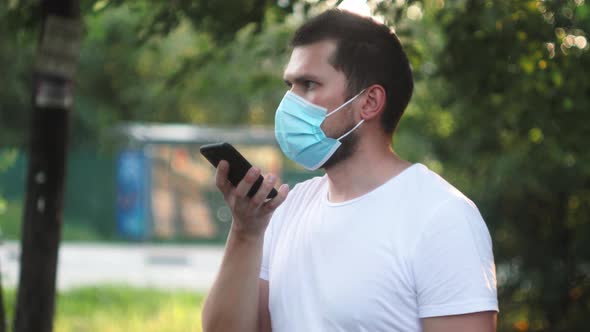 Student Freelancer Man Having Online Meeting on Street Voice Recognition Speech Recovery