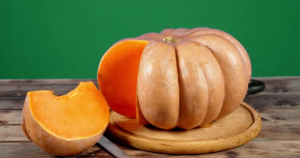 A Piece of the Big Pumpkin Falls on the Table.