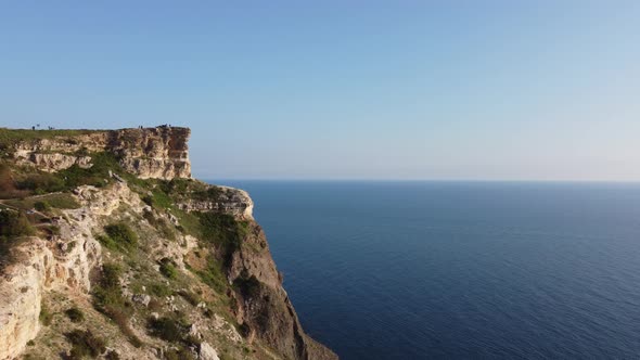 Aerial View From Above on Azure Sea and Volcanic Rocky Shores