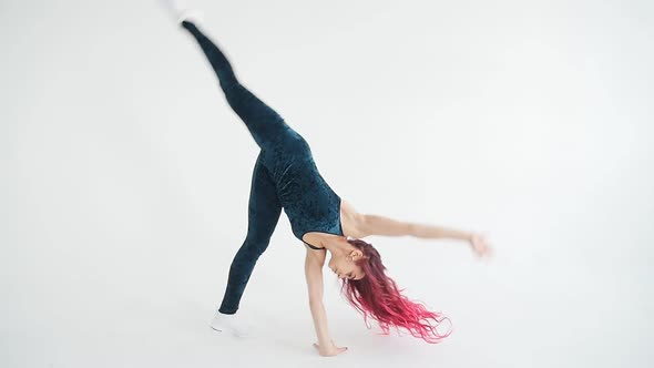 Woman Acrobat on the Hula Hoop In the White Background