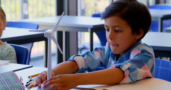 Schoolkids studying at desk in the classroom at school 4k