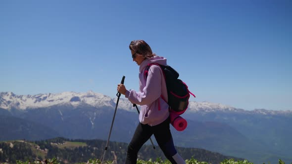 Girl Traveler Hiking in the Mountains