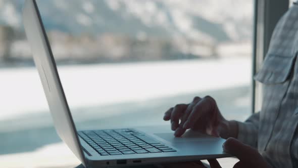 Woman Freelancer Working at Home Near Window Using Laptop