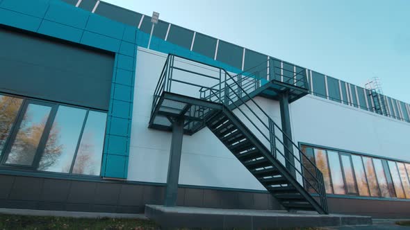 Metal Staircases on Wall of Stylish Building on City Street