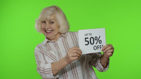 Senior Grandmother Showing Sale 50 Percent Off Banner Advertisement. Online Shopping, Black Friday