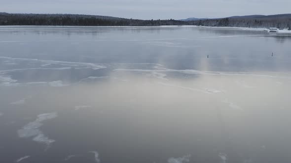 Reflective ice across frozen lake surface Aerial