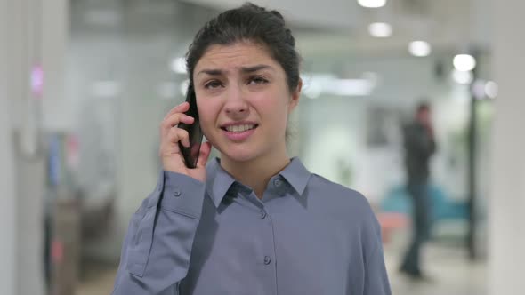 Portrait of Angry Indian Woman Talking on Smartphone