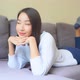 Asian woman sit on sofa and relax - VideoHive Item for Sale