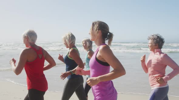 Athletic women running on the beach