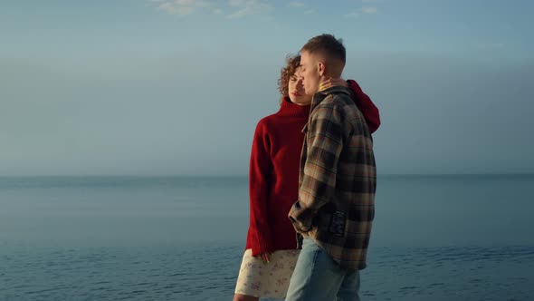 Sensual Woman Embracing Man on Sea Beach