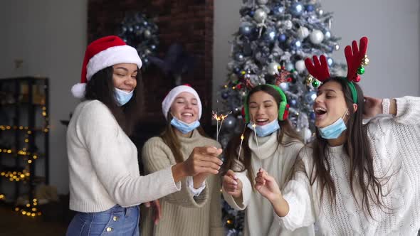 Multiethnic Young People Celebrating New Year Eve Holding Sparklers