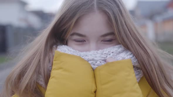 Close-up of Pretty Caucasian Girl with Brown Eyes and Blond Hair Standing Outdoors, Pretty Teen 