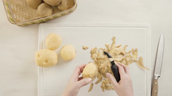 Step by step. Peeling Yukon gold potatoes for classic mashed potatoes.