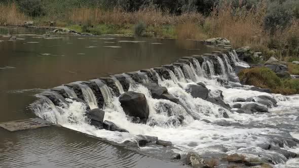 SLOW MOTION, River Water Flowing Over Rocky Weir