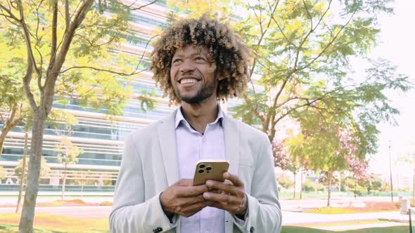 Successful Positive Brazilian or African American Curly Haired Man Wearing Stylish Formal Clothes