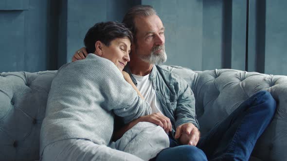 Aged Couple Sitting on the Sofa