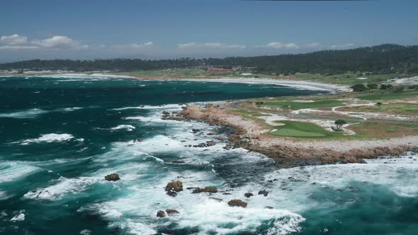 Drone Flying Around the Green Golf Course with Scenic Landscape on a Background