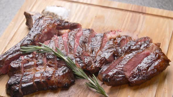 Cooking Concept. Grilled Marinated Beef Flank Steak on Wooden Board