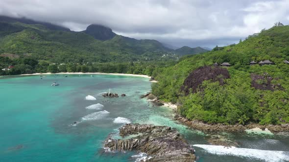 Aerial view of a few sailing boats anchored at Port Launay, Mahe, Seychelles.