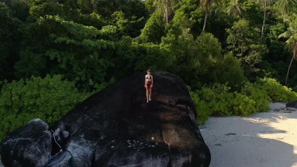 Woman Alone at Tropical Beach Drone Goes Away From Female to the Sky