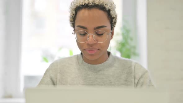 Close Up of African Woman Having Toothache While Using Laptop