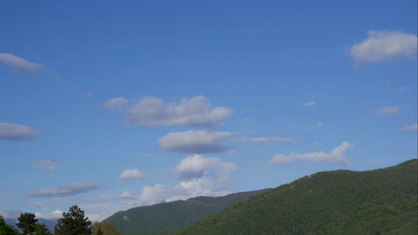 Blue Sky White Clouds Over the Mountains