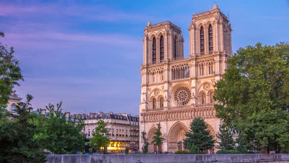 Front View of Notre Dame De Paris Cathedral Day To Night Timelapse After Sunset