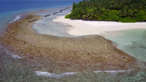 Warm nature of marine resort beach time by clear lagoon with sand background in sunlight