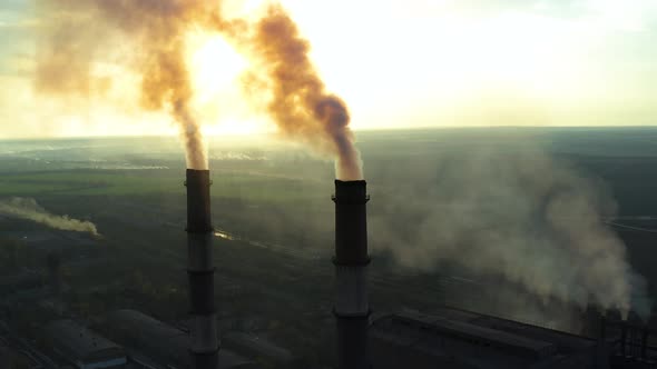 Industrial Zone with a Large Red and White Pipe Thick White Smoke Is Poured From the Factory Pipe in