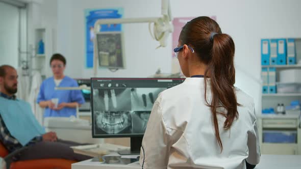 Stomatologist Doctor Smiling at Camera in Dental Office