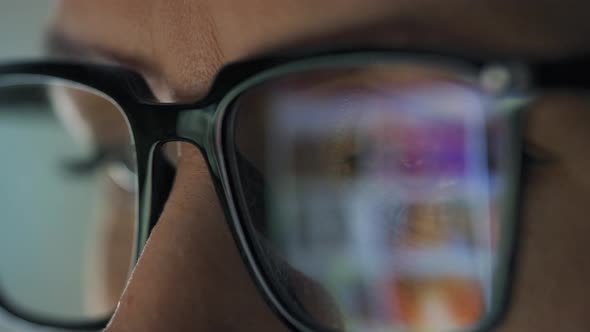 Woman in Glasses Looking on the Monitor and Surfing Internet