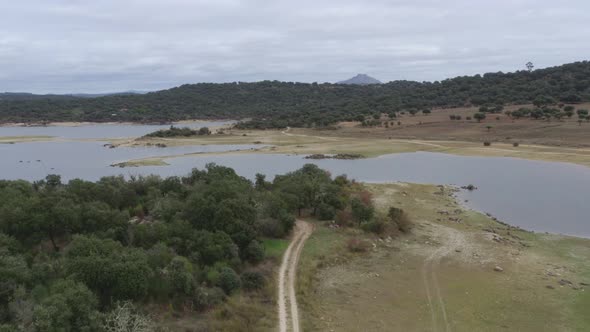 Lake drone aerial view of a camper van with solar panel living van life mountain panorama landscape